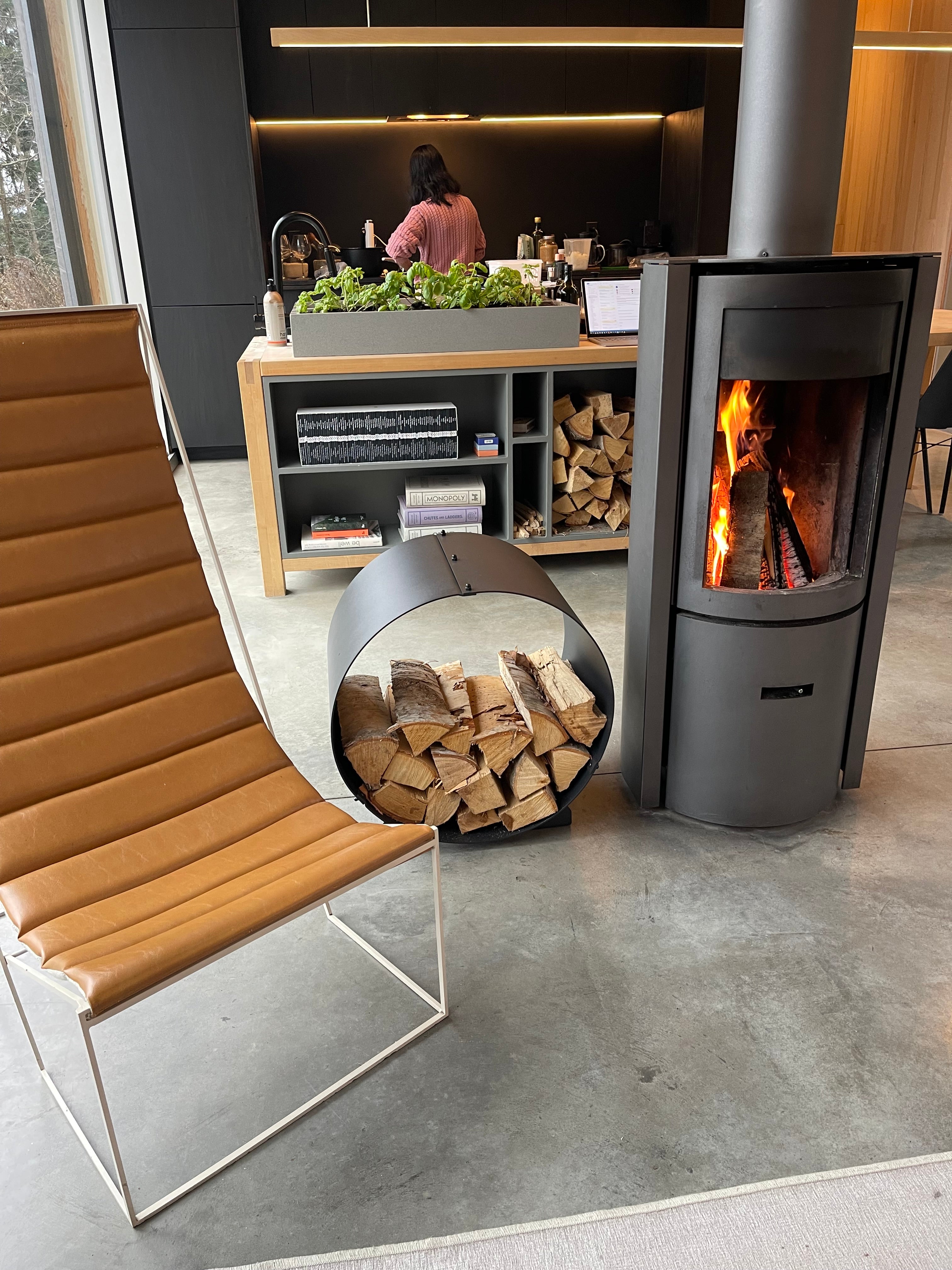 Circular firewood rack in black metal fireplace accessories from The Rack Co.